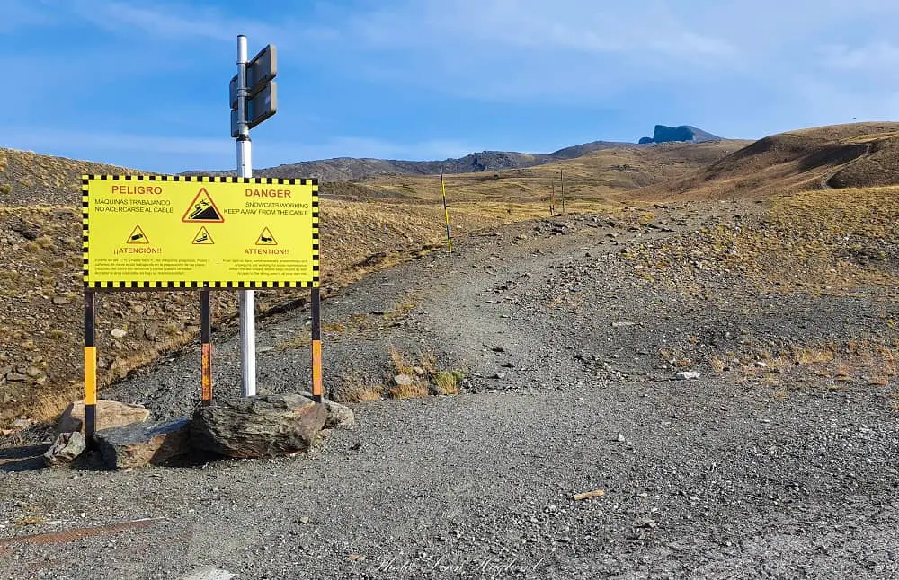 Follow the trail by the yellow danger sign