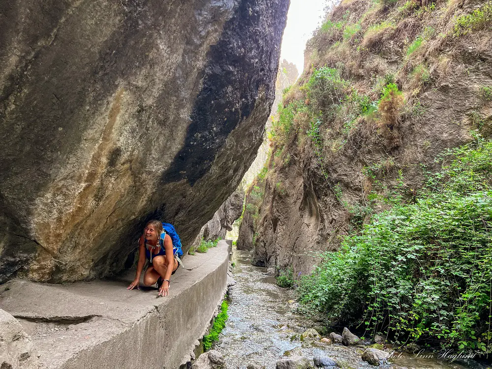 Me crawling under the mountain in Cahorros trail.