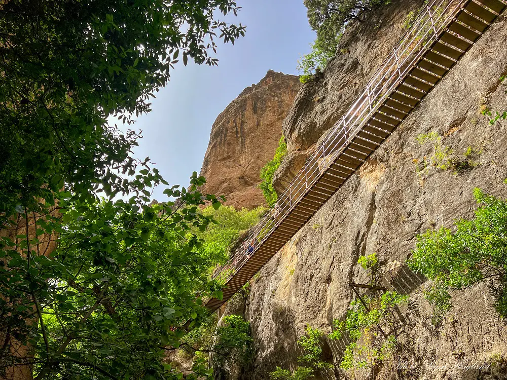 Me crossing the longest Hanging bridge in Cahorros de Monachil (seen from the water hole below)