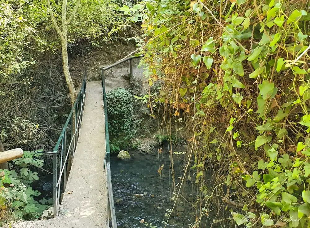 A narrow bridge crossing a river