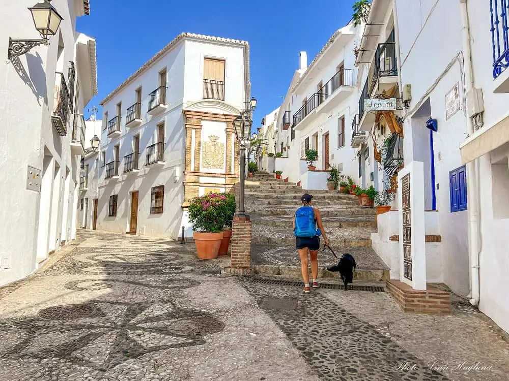 Me and my dog walking through the cobbled streets of the whitewashed village of Frigiliana.