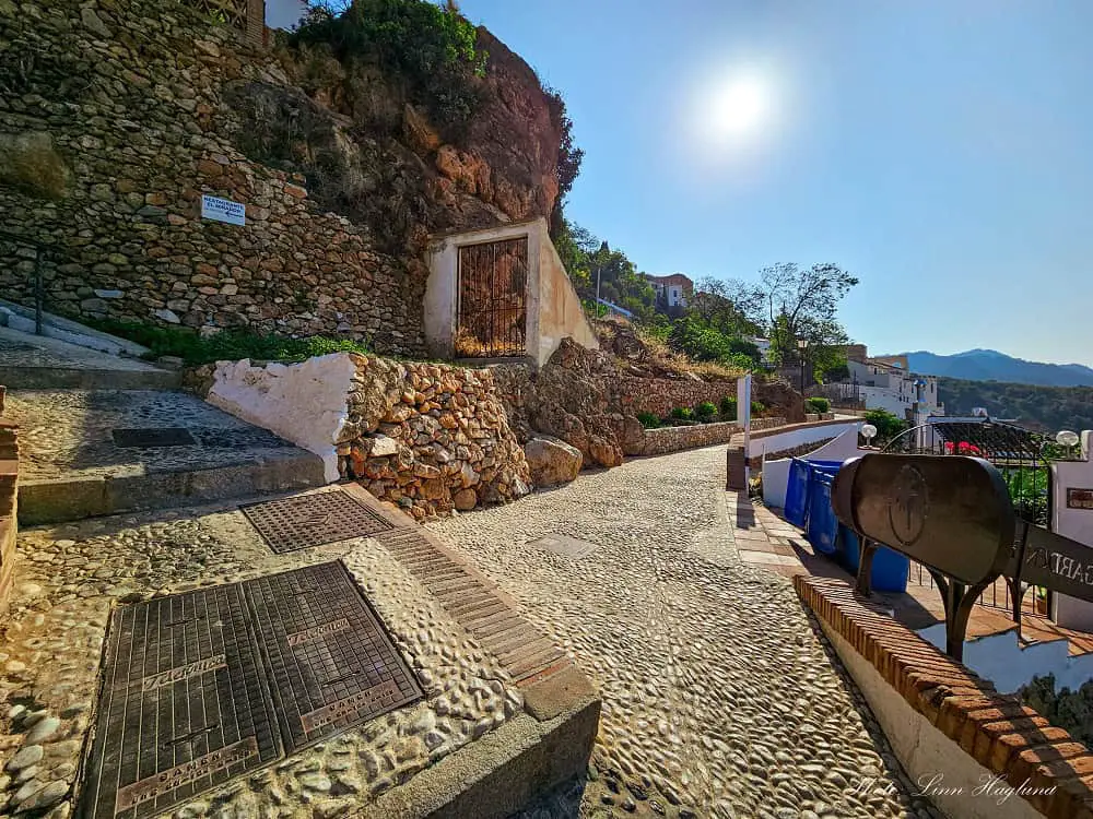 Start of Acequia del Lizar trail, a cobbled street on top of the village.