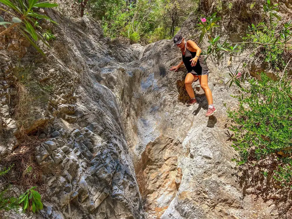 Climbing down the dry waterfall.