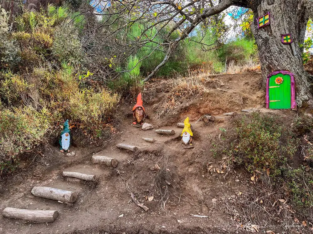 Small, colorful, wooden gnomes in Bosque Encantado Parauta.