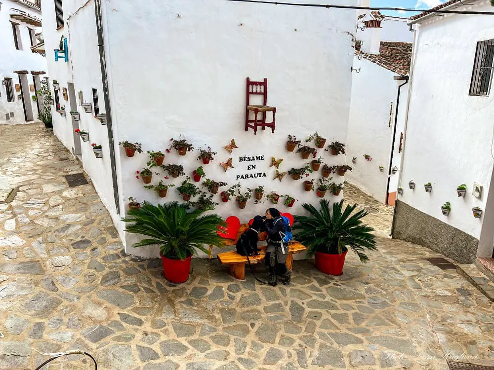 Me and my dog Ayla on a bench in Parauta village.