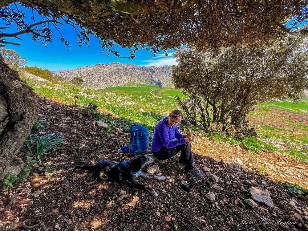 Atlas and me having a snack break in the shade of a tree.