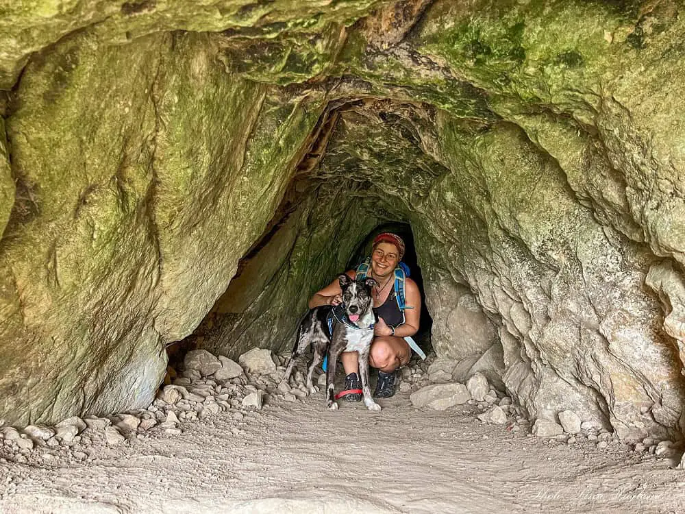 Me and Atlas sitting inside the water mine tunnel at Las Arquillas trail Antequera Malaga Spain.