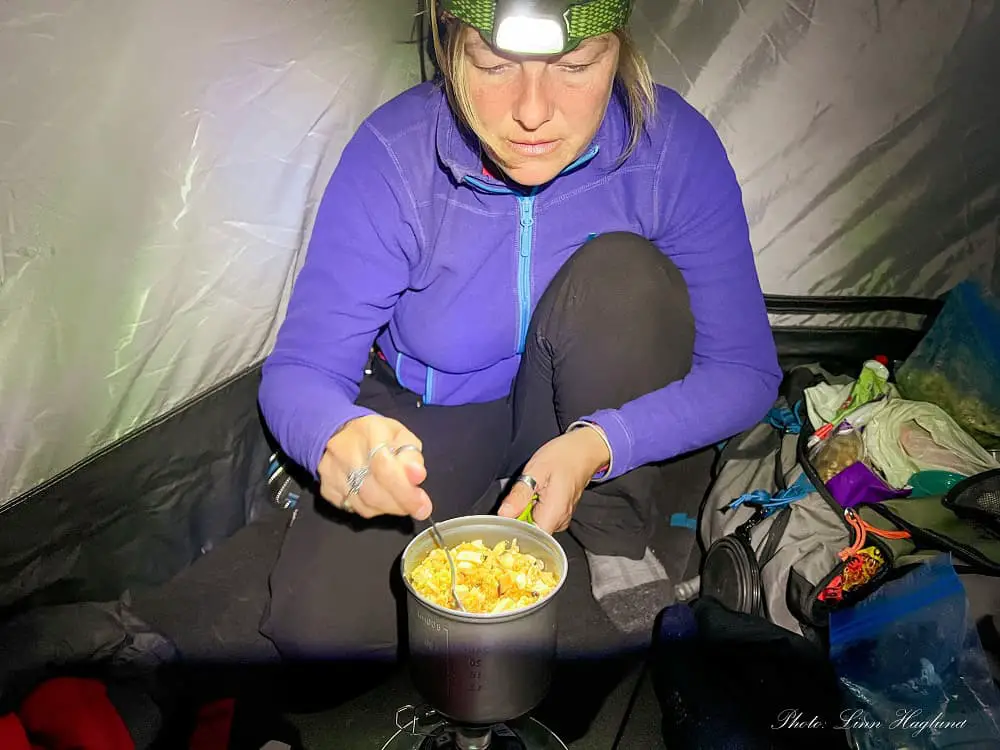 Me Cooking in the tent with a headlamp.